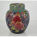 A William Moorcroft ginger jar and cover, deocrated in the Finches pattern, with signed base, and