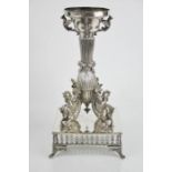 A 19th century silver plated candlestand, modelled with four mythological hippocampus, at the foot