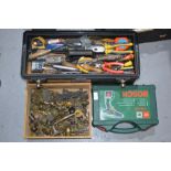 A toolbox with a quantity of hand tools and a group of ironmongery