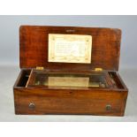 A 19th century music box, in a mahogany case.