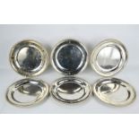 A fine set of six Paul Storr silver dinner plates, with beaded edges, and all engraved with two