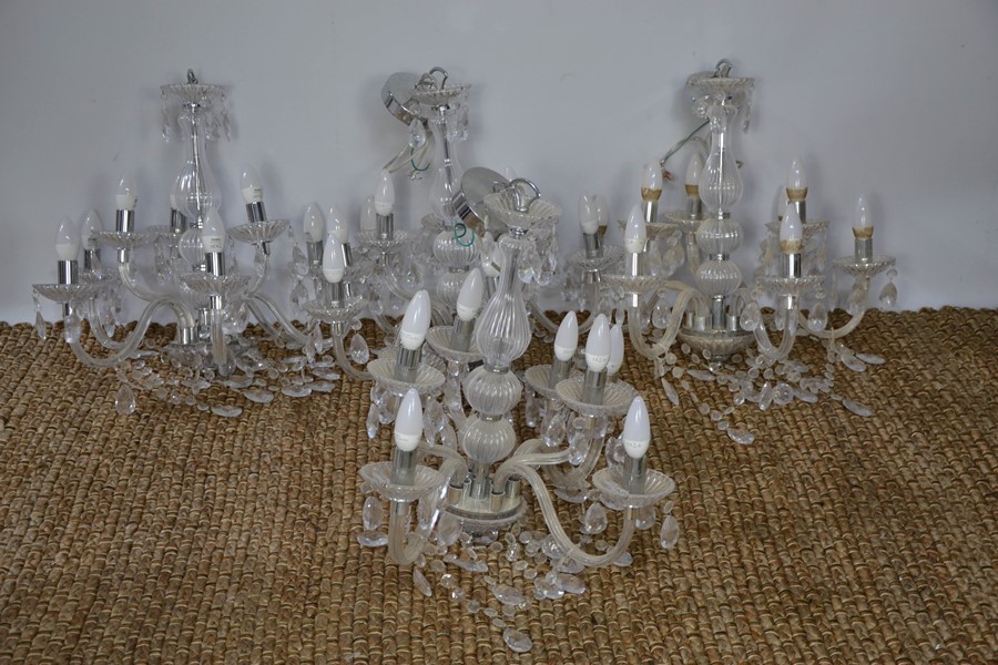 A set of four chrome Dunelm chandeliers.