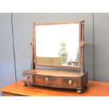 A Victorian mahogany toilet mirror, with bow front comprising three drawers.