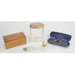 A silver and glass dressing table pot and scent bottles, together with a pair of Edwardian pince nez