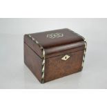 A 19th century tea caddy inlaid with mother of pear, the top with the word TEA.