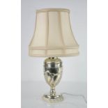 A silver table lamp and shade, London 1894, William Gibson and John Lawrence Langham, 45cm high with