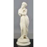 A 19th century Parian ware figure of a woman, modelled holding a dove, 27cm high.