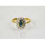 An 18ct white and yellow gold diamond and aquamarine, the aquamarine approximately 0.60ct, and