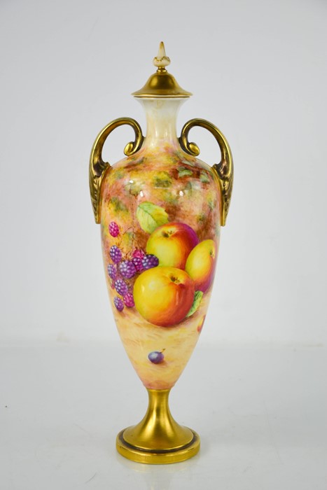 A fine Royal Worcester painted with vase and cover, painted with peaches, grapes and apples on mossy