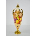 A fine Royal Worcester painted with vase and cover, painted with peaches, grapes and apples on mossy