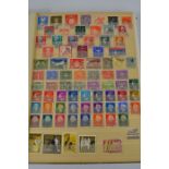 A stamp album of British and worldwide stamps to include - Luxembourg - Poland - Italy - Russia -
