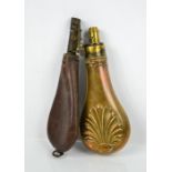 Two Victorian powder flask, one in leather the other in brass.