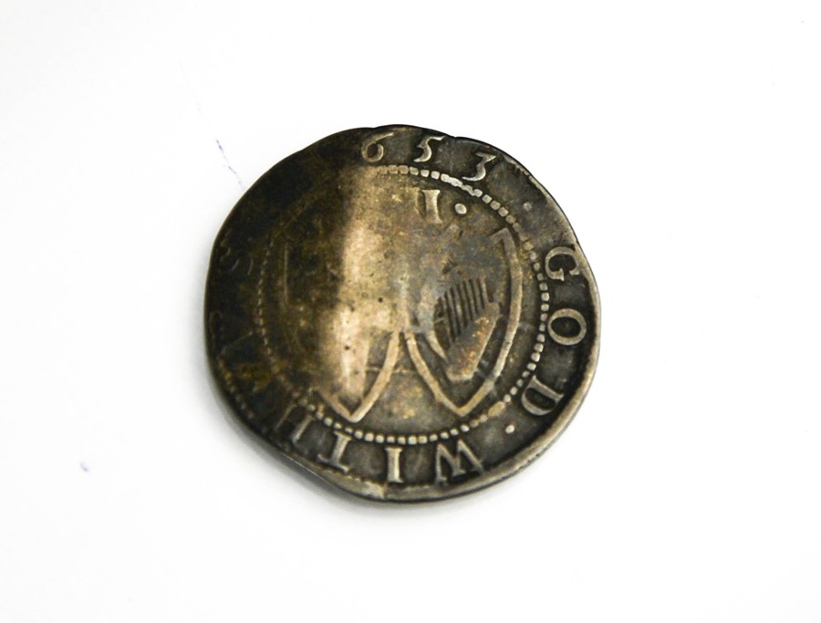 A silver commonwealth shilling, year of issue 1653, also known as 'Breeches Money'.