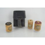 A German WWII ammo pouch together with three rolls of unused uniform cotton