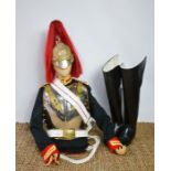 A Household Cavalry trooper uniform, complete with helmet with red plume and boots.