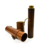 A military telescope in leather case.