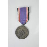 A German Fur Verdienste im Luftschutz medal, ring stamped l/14