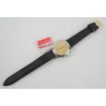 A WWII era pilots wristwatch by Olma with original tag