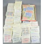 A quantity of British stamps in individual packets of a hundred dating from the 1960s and 1970s,