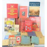 A group of military related books, military insignia, Normandy to Berlin and some WWII dated
