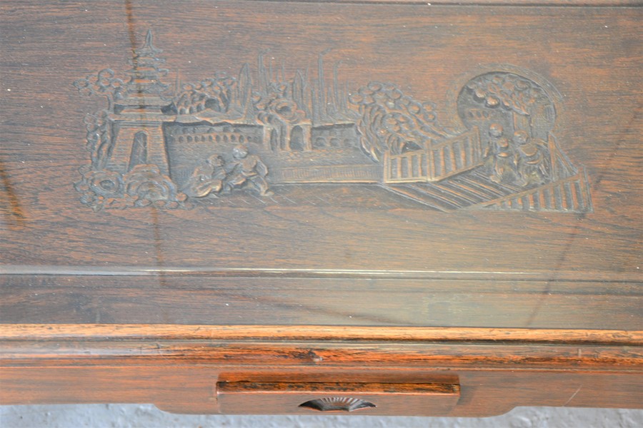 A Chinese carved coffee table, with figural scene to top, single drawer to front, 42cm high by - Bild 2 aus 2