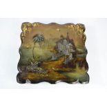 A 19th century black laquered paper mache box, the lid decorated with an exotic Asian scene, with