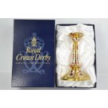 A Royal Crown Derby candlestick in the Imari pattern 1128, in the original box.