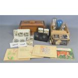 A group of cigarette cards in albums and loose together with a Camerascope, vintage light bulbs etc