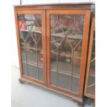 A 19th century mahogany display cabinet with glazed doors, 138cm by 118cm by 37cm