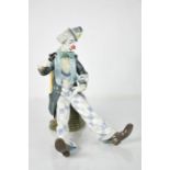 A Lladro porcelain clown, with alarm clock and magnifying glass, 24cm high.