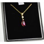 A yellow gold, rubellite and diamond pendant and chain, the rubellite 1.65ct approx, the diamond 0.