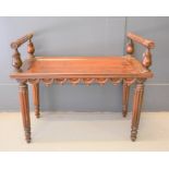 A Victorian rosewood window seat with reeded arms raised on tulip form columns and reeded legs, 61cm