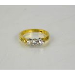 An 18ct yellow gold vintage three stone diamond trilogy ring, size K, 3g.