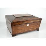 A 19th century rosewood sewing box, with mother of pearl inlaid escutcheon and the fitted interior