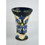 A Moorcroft vase in the Kaffir Lily pattern, designed by Shirley Hayes, of trumpet form, signed S