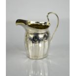 A silver jug, engraved with decoration, hallmarked London 1792, 4.3toz.