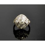 An Art Deco diamond and platinum ring, the central diamond approximately 0.8cts, flanked by two