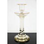 A Georgian style glass candlestick with spiral decoration to the inner stem, 23cm high.
