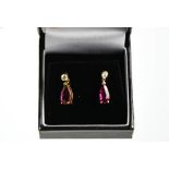A pair of rubellite and diamond earrings, the rubellite 2.48ct approx and the diamond 0,20ct, 3.2g.