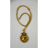 A 9ct gold tag pendant, on an un-tested yellow metal chain, 8.6g.