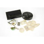 A Victorian papier mache snuff box, claret bottle tag, mother of pearl counters, and a metal trinket