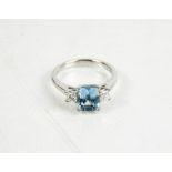 An 18ct white gold, aquamarine and diamond three stone ring, the aquamarine 1.7ct, the diamonds