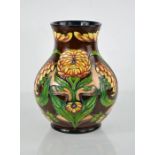 A Moorcroft limited edition vase designed by Philip Gibson, titled Dahlia, signed by the artist