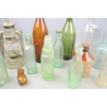 A group of collectible glass bottles to include Bovril and Hancocks examples