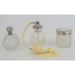 Three glass and silver dressing table pots, comprising perfume atomizer, scent bottle with hinged