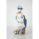 A Lladro clown, holding an umbrella with puppy at his feet, 5838, 28cm high.