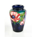 A Moorcroft vase in the Poppy pattern, 13cm high.