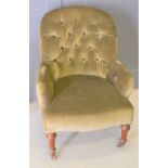 A Victorian button backed armchair, in green dralon. 92cm overall height, 38cm seat height.