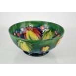 A Moorcroft bowl, signed to the base by William Moorcroft, in the Leaf & Berry pattern, 24cm