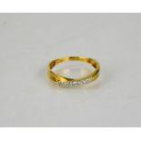 An 18ct gold and diamond ring, size M, 1.9g.